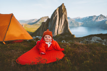 Baby on camping mat in mountains family vacations adventure healthy lifestyle cute child hiking activity kid outdoor in Norway Segla mountain landscape