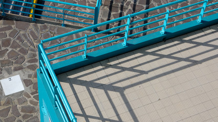 Fototapeta premium Blue railings and terraces at the seaside