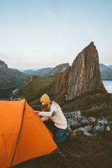 Fototapeta premium Camping tent in mountains woman traveling in Norway adventure healthy lifestyle active summer vacations Segla mountain view