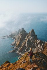 Woman hiking alone travel in Norway adventure vacations healthy lifestyle explore summer activity Vesteralen landscape rocks and sea aerial view © EVERST