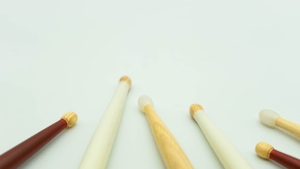 Close up view of wooden drumsticks on a white background. Musical instrument concept.