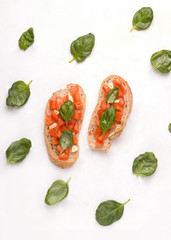 Bruschetta - a traditional Italian dish with tomato, garlic and basil on toast