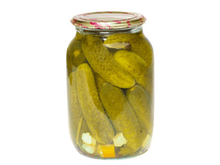 Glass jar with homemade canned pickled cucumbers on a white background