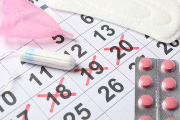 Menstruation period concept with calendar, close up