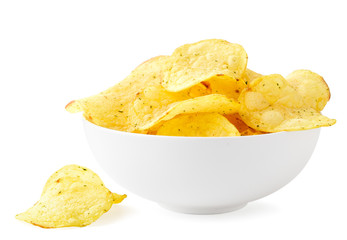 Potato chips with seasonings in a plate and scattered on a white. Isolated