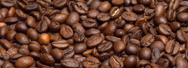 Coffee beans background. Coffee beans close up on the table. Coffe concept