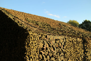 large military camouflage  tent, command center in a training camp