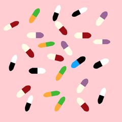 Pills or capsules on pink background