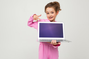 contented caucasian girl holding a laptop with the screen forward with the layout for the page on a white background