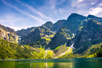Panoramic view of Morskie Oko lake with Tatra Mountains peaks - Zabia Turnia, Wolowy Grzbiet,...