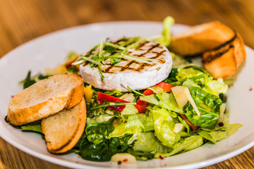 Fresh garden salad. Fresh garden salad on a plate. Fresh and healthy vegetable salad with cheese