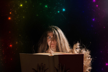 Magic Woman reading a book. black background
