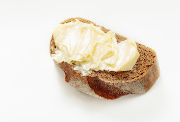 butter on bread isolated white background