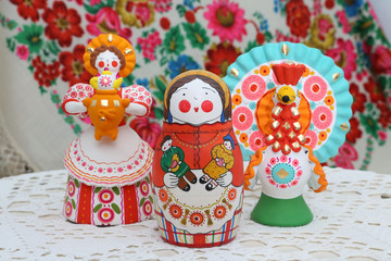 Old russian national wooden nested doll, matryoshka, in form of woman in russian national costume...