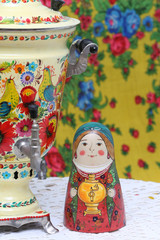 Russian traditional wooden nesting toy - matryoshka, nested doll in form of woman in national...