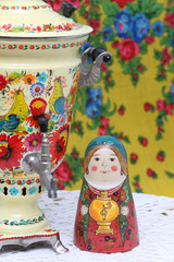 Russian traditional wooden nesting toy - matryoshka, nested doll in form of woman in national...