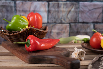 Red and green chili peppers in a dark background