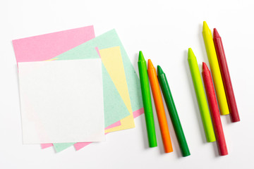 Fototapeta premium Blank colorful note paper with wav pencils isolated on white.