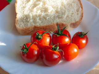 Cherry tomatoes and a slice of toast bread
