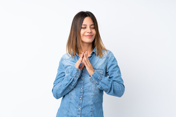 Young woman over isolated white background scheming something