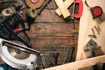 Carpentry concept background with copy space. Top view. Work tools on wooden background.