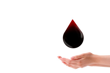 World Blood Donation Concept : Female hand  holding red blood falling down with white background.
