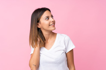 Fototapeta premium Young woman over isolated pink background thinking an idea