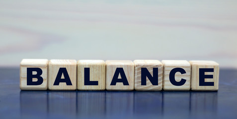 concept word balance on cubes on a beautiful blue background