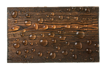 Classic rectangular wooden dark board in drops of water.