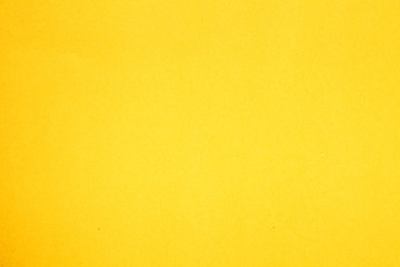 yellow sheet of colored paper background texture