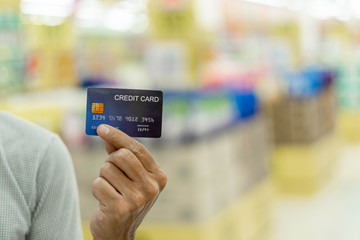 Hand holding credit card, Finance concept. prepare for shopping online. copy space background for text