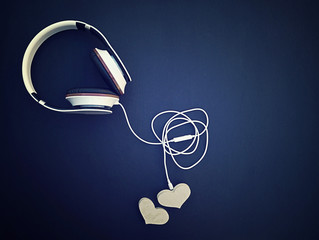 Music of hearts. Listen to your heart.  heart with headphones on dark background. Love listening to music.