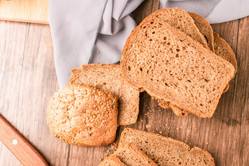Finely toasted bread slices on a wooden board