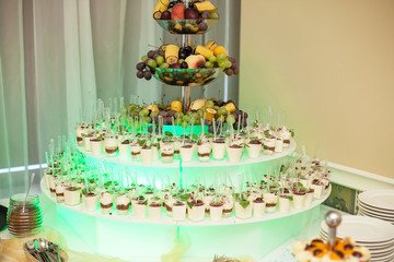 Wedding sweet table background. Desserts catering and cakes company. Elegant wedding venue. Polish wedding sweets corner.