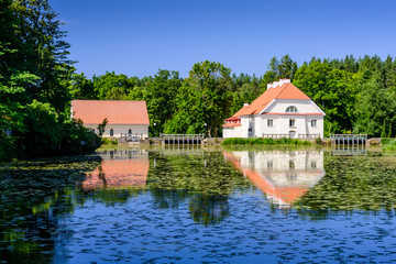 Fototapeta na wymiar Sightseeing of Estonia. Vihula manor (Vihula möis) museum in Lahemaa National Park. Beautiful summer landscape. A picturesque Park with a pond.