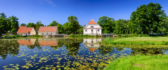 Sightseeing of Estonia. Vihula manor (Vihula möis) museum in Lahemaa National Park. Beautiful summer landscape. A picturesque Park with a pond.