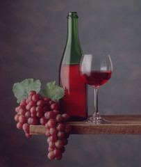 Red wine bottle, glass, grapes