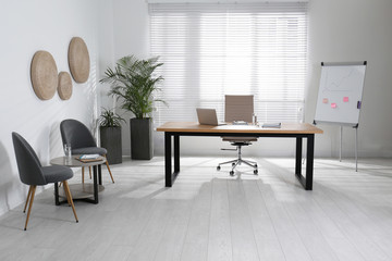 Director's office with large wooden table. Interior design