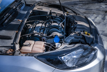 Car engine in an open hood