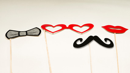 Fun and carnival concept, paper masks held in hands