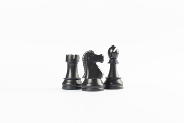 Black rook, queen and bishop isolated on white background