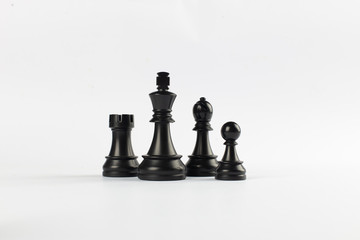 Black rook, queen, pawn and bishop isolated on white background