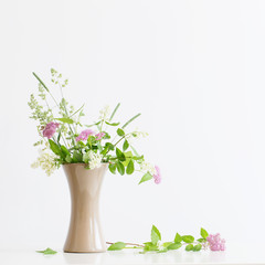Naklejka na ściany i meble summer flowers in vase on table