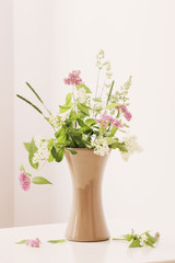 summer flowers in vase on table