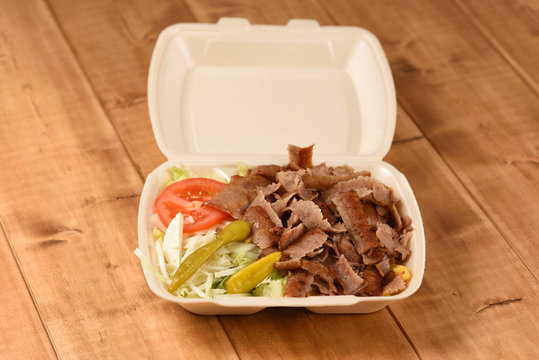 Delivered fast food doacner in a plastic box