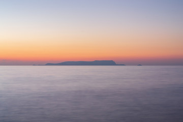 Naklejka premium Abstract view on the beach in Crete in the evening. Long exposure.