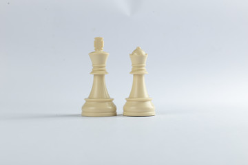 White king and queen figures isolated on white background