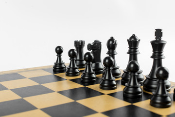 Black chess figures on the chessboard