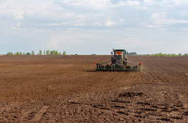 Fototapeta premium tractor working in the field
