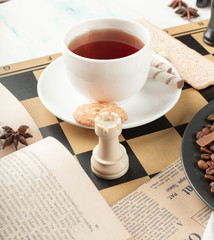 A cup of tea and a chess rook